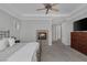 Spacious main bedroom boasts a fireplace, tray ceiling, and ample natural light at 420 Pinnacle Heights Ln, Las Vegas, NV 89144