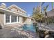 Backyard pool area featuring desert landscaping, a sparkling pool, and a covered patio at 420 Pinnacle Heights Ln, Las Vegas, NV 89144
