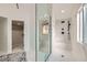 Modern bathroom with a glass shower, marble floors, and sleek fixtures at 4961 Tierra Del Sol Dr, Las Vegas, NV 89113