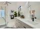 Modern bathroom with a double sink vanity, marble floors, and glass shower at 4961 Tierra Del Sol Dr, Las Vegas, NV 89113