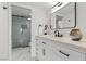 Modern bathroom with a glass shower, marble floors, and sleek fixtures at 4961 Tierra Del Sol Dr, Las Vegas, NV 89113