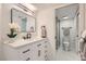 Stylish bathroom with a modern vanity, sleek fixtures, and a walk-in shower at 4961 Tierra Del Sol Dr, Las Vegas, NV 89113