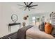 Spacious bedroom with a vaulted ceiling, ceiling fan, and plush bed at 4961 Tierra Del Sol Dr, Las Vegas, NV 89113