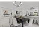 Elegant dining area featuring marble flooring, stylish decor, and an open view into the modern kitchen at 4961 Tierra Del Sol Dr, Las Vegas, NV 89113
