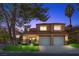 Charming two-story home featuring a tile roof, attached two-car garage, and professionally landscaped front yard at 4961 Tierra Del Sol Dr, Las Vegas, NV 89113
