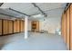 Spacious garage featuring epoxy floors, built-in cabinets, and ample storage space for vehicles and equipment at 4961 Tierra Del Sol Dr, Las Vegas, NV 89113