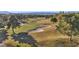 Scenic aerial view of a well-maintained golf course, with manicured greens, sand traps, and mature trees at 4961 Tierra Del Sol Dr, Las Vegas, NV 89113