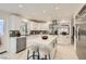 Modern kitchen with white cabinets, stainless steel appliances, and a center island with seating at 4961 Tierra Del Sol Dr, Las Vegas, NV 89113