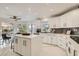 Well-lit kitchen with white cabinets, a center island, stainless steel appliances, and a breakfast nook at 4961 Tierra Del Sol Dr, Las Vegas, NV 89113