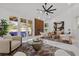 Bright living room boasting modern decor and views of the pool area at 4961 Tierra Del Sol Dr, Las Vegas, NV 89113