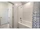 Bright bathroom with a tiled tub and shower, featuring a stylish shower curtain at 600 N Carriage Hill Dr # 1143, Las Vegas, NV 89138