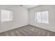 Bright bedroom features neutral walls and soft carpet, illuminated by natural light through window blinds at 600 N Carriage Hill Dr # 1143, Las Vegas, NV 89138