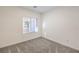Clean bedroom with neutral carpet, window with blinds, base trim, and fresh white paint at 600 N Carriage Hill Dr # 1143, Las Vegas, NV 89138