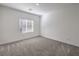 Cozy bedroom with neutral carpet and window, offering a blank canvas for decor at 600 N Carriage Hill Dr # 1143, Las Vegas, NV 89138