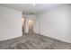 Carpeted bedroom with adjoining bathroom and stairs at 600 N Carriage Hill Dr # 1143, Las Vegas, NV 89138