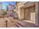 Inviting front entrance with a modern door, stone accents, and desert-friendly landscaping at 600 N Carriage Hill Dr # 1143, Las Vegas, NV 89138