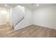Upstairs living area with stairs, and a doorway to another room with light wood flooring at 600 N Carriage Hill Dr # 1143, Las Vegas, NV 89138