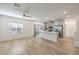 Open concept living room and kitchen with stainless steel appliances and sliding door to backyard at 600 N Carriage Hill Dr # 1143, Las Vegas, NV 89138