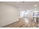 Spacious living room leading to the kitchen with modern light fixture and sliding glass door at 600 N Carriage Hill Dr # 1143, Las Vegas, NV 89138