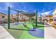 Community playground featuring modern equipment under a shaded canopy, perfect for Gathering fun at 600 N Carriage Hill Dr # 1143, Las Vegas, NV 89138