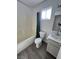 Well-lit bathroom featuring a bathtub, toilet, vanity with sink, and modern fixtures at 6104 Hillside Bloom Ct # 201, Las Vegas, NV 89130
