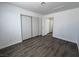 Well-lit bedroom with a closet, wood floors and neutral walls at 6104 Hillside Bloom Ct # 201, Las Vegas, NV 89130