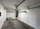 Clean garage with storage shelving and a freshly painted interior at 6104 Hillside Bloom Ct # 201, Las Vegas, NV 89130
