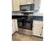 Kitchen featuring a stainless steel oven, microwave, and modern countertops at 6104 Hillside Bloom Ct # 201, Las Vegas, NV 89130