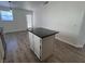 Open kitchen with an island and access to the backyard at 6104 Hillside Bloom Ct # 201, Las Vegas, NV 89130