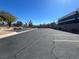 Spacious community parking lot with ample parking spaces and desert landscaping at 6104 Hillside Bloom Ct # 201, Las Vegas, NV 89130