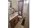 Bright bathroom featuring a vanity, sink, mirror, and combination shower and tub at 6624 Socorro Dr, Las Vegas, NV 89108