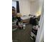 Untidy bedroom with a bed, suitcase, and several boxes and bags around the room at 6624 Socorro Dr, Las Vegas, NV 89108
