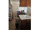 Kitchen featuring wooden cabinetry, white appliances, and a tile floor at 6624 Socorro Dr, Las Vegas, NV 89108