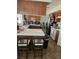 Kitchen features wooden cabinetry, white tile countertops, and appliances at 6624 Socorro Dr, Las Vegas, NV 89108