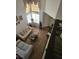 Spacious living room area with comfortable sofas, a coffee table, and natural light from a window at 6624 Socorro Dr, Las Vegas, NV 89108