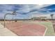 Community basketball court with two hoops and a well-maintained playing surface, perfect for active residents at 6952 Midnight Bronze St, North Las Vegas, NV 89086