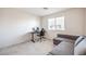 Spare bedroom with a desk, chair, sofa and window at 6952 Midnight Bronze St, North Las Vegas, NV 89086