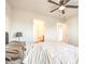 A Primary bedroom bathed in natural light with a ceiling fan and ensuite bathroom at 6952 Midnight Bronze St, North Las Vegas, NV 89086