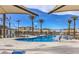 Community pool with easy access for all, surrounded by lounge seating and well-maintained landscaping at 6952 Midnight Bronze St, North Las Vegas, NV 89086