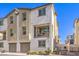 Attractive townhouse boasts a private balcony and two-car garage at 6952 Midnight Bronze St, North Las Vegas, NV 89086