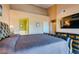 Bright bedroom suite with en-suite bath, a large screen TV, and a comfortable bed for a great night's sleep at 7700 Constanso Ave # 204, Las Vegas, NV 89128