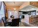 Dining area featuring an open layout, adjacent to the kitchen and a sliding glass door to the patio at 7700 Constanso Ave # 204, Las Vegas, NV 89128