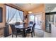 Cozy dining area bathed in natural light, featuring a modern table and convenient access to the kitchen at 7700 Constanso Ave # 204, Las Vegas, NV 89128