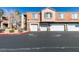 Exterior view of condo garages, showcasing multiple parking spaces and convenient access for residents at 7700 Constanso Ave # 204, Las Vegas, NV 89128