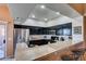 Contemporary kitchen with stainless steel appliances, granite countertops, and bar stool seating at 7700 Constanso Ave # 204, Las Vegas, NV 89128