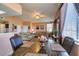 Open floor plan featuring living room connected to the dining area with comfortable couches at 7700 Constanso Ave # 204, Las Vegas, NV 89128