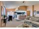 Open-concept living area with natural light, a dining area, and a breakfast bar for casual dining at 7700 Constanso Ave # 204, Las Vegas, NV 89128