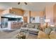 Bright living room with an open floor plan, blending the living area and kitchen for modern living at 7700 Constanso Ave # 204, Las Vegas, NV 89128