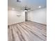 Bonus room featuring a ceiling fan and stylish laminate flooring, perfect for entertaining at 7708 Mojave Wind Ave, Las Vegas, NV 89113