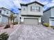 Charming two-story home with a stone-accented facade and well-manicured landscaping at 7708 Mojave Wind Ave, Las Vegas, NV 89113
